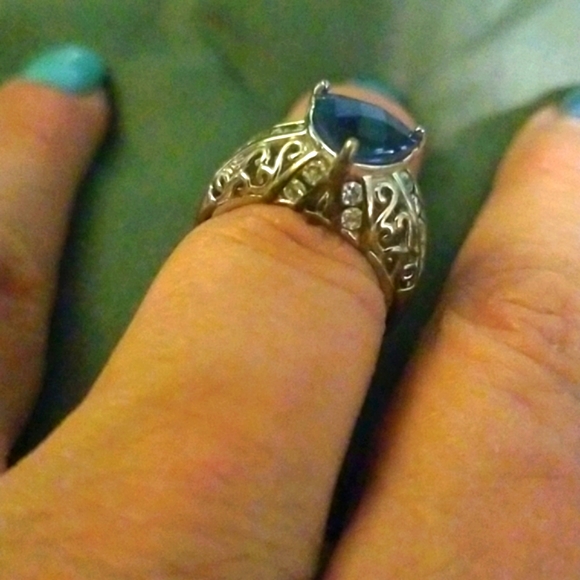 Sterling silver with cz and tanzanite center stone. - Picture 3 of 4
